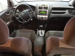 2006 Kia Sportage LX with VIN KNDJF723567196181, listed as a Copart auction lot 86598884 with 169,674 mi miles and Salvage Title. Bid and sale history available at carsss.com. Image 8.
