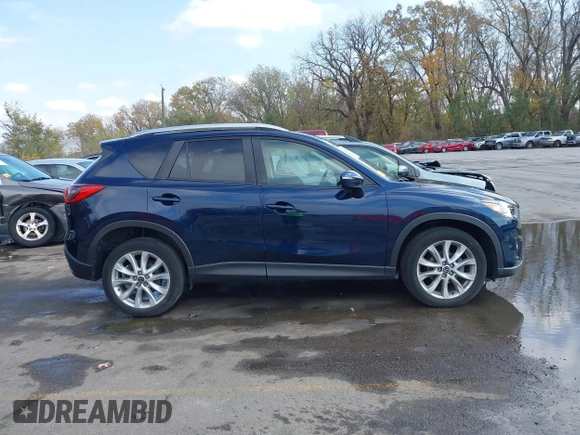 2015 Mazda CX-5 Grand Touring with VIN JM3KE4DY7F0478823, listed as a IAAI auction lot 40731626 with 82,884 mi miles. Bid and sale history available at carsss.com. Image 13.
