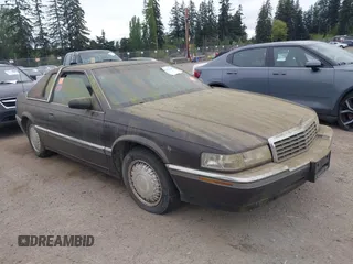 1992 Cadillac Eldorado z VIN 1G6EL13B0NU605624, wystawiony jako IAAI lot #42127549 z przebiegiem Nie podano mil oraz . Historia ofert i sprzedaży dostępna na DreamBid. Obrazek 1.