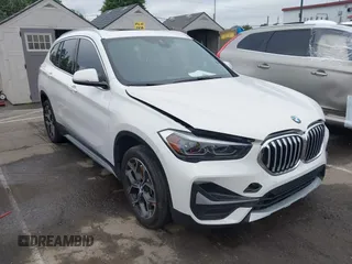 2021 BMW X1 xDrive28i z VIN WBXJG9C01M5S06181, wystawiony jako IAAI lot #42292167 z przebiegiem 55 966 mil mil oraz . Historia ofert i sprzedaży dostępna na DreamBid. Obrazek 1.