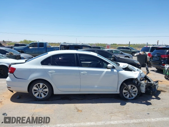 2015 Volkswagen Jetta SE z VIN 3VWD07AJ5FM346565, wystawiony jako IAAI lot #42104880 z przebiegiem 93 491 mil mil oraz . Historia ofert i sprzedaży dostępna na DreamBid. Obrazek 13.