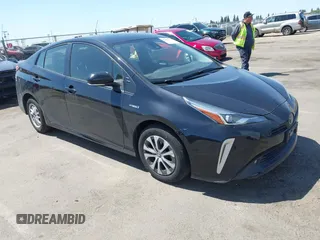 2021 Toyota Prius LE z VIN JTDL9MFUXM3024282, wystawiony jako IAAI lot #42304474 z przebiegiem 67 019 mil mil oraz . Historia ofert i sprzedaży dostępna na DreamBid. Obrazek 1.