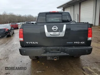 2011 Nissan Titan Pro-4X z VIN 1N6BA0EC2BN325891, wystawiony jako Copart lot #43241505 z przebiegiem Nie podano mil oraz Szkoda całkowita • Salvage title. Historia ofert i sprzedaży dostępna na DreamBid. Obrazek 6.