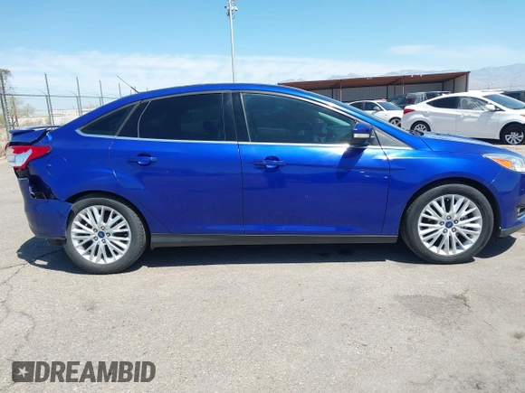 2015 Ford Focus Titanium with VIN 1FADP3J25FL314903, listed as a IAAI auction lot 42053132 with 125,418 mi miles and . Bid and sale history available at carsss.com. Image 14.