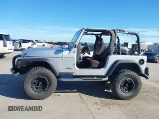 2002 Jeep Wrangler X with VIN 1J4FA39S42P763835, listed as a IAAI auction lot 42302645 with 233,634 mi miles and . Bid and sale history available at DreamBid. Image 15.