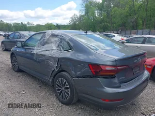 2019 Volkswagen Jetta S z VIN 3VWC57BUXKM121316, wystawiony jako IAAI lot #42290107 z przebiegiem 117 371 mil mil oraz . Historia ofert i sprzedaży dostępna na DreamBid. Obrazek 3.