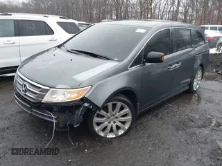 2012 Honda Odyssey Touring with VIN 5FNRL5H98CB089871, listed as a IAAI auction lot 41351447 with 999,999 mi miles. Bid and sale history available at carsss.com. Image 2.