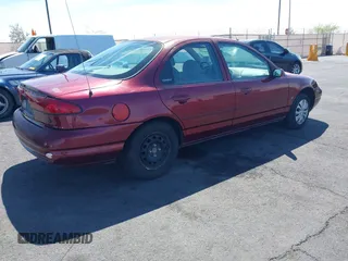 1999 Ford Contour z VIN 1FAFP6538XK117065, wystawiony jako IAAI lot #42088857 z przebiegiem 138 489 mil mil oraz . Historia ofert i sprzedaży dostępna na DreamBid. Obrazek 4.