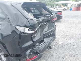 2024 Mazda CX-90 Preferred z VIN JM3KKBHD6R1118705, wystawiony jako IAAI lot #42135120 z przebiegiem 23 347 mil mil oraz . Historia ofert i sprzedaży dostępna na DreamBid. Obrazek 6.