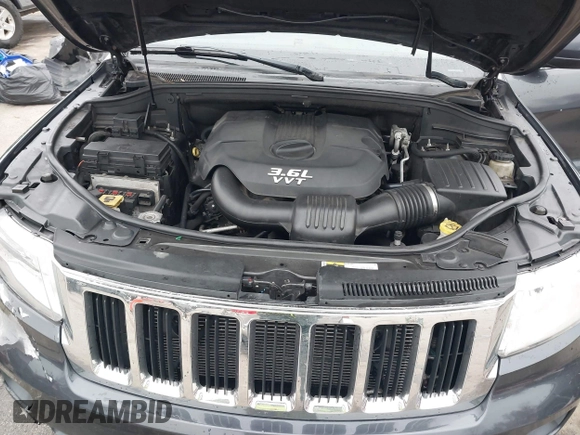 2013 Jeep Grand Cherokee Laredo with VIN 1C4RJFAG9DC506238, listed as a IAAI auction lot 41800981 with 172,676 mi miles. Bid and sale history available at carsss.com. Image 10.