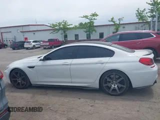 2015 BMW M6 z VIN WBS6C9C50FD467538, wystawiony jako IAAI lot #42366043 z przebiegiem 66 379 mil mil oraz . Historia ofert i sprzedaży dostępna na DreamBid. Obrazek 14.