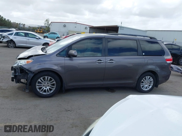 2014 Toyota Sienna XLE with VIN 5TDYK3DC7ES517206, listed as a IAAI auction lot 41945572 with 128,743 mi miles and . Bid and sale history available at DreamBid. Image 15.