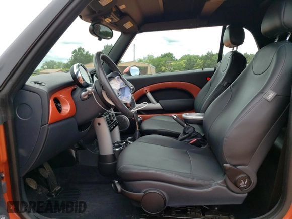 2006 MINI Convertible with VIN WMWRF335X6TF64910, listed as a Copart auction lot 60222215 with 85,761 mi miles and Salvage title. Bid and sale history available at DreamBid. Image 7.