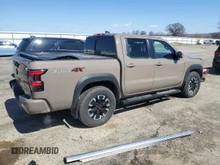 2024 Nissan Frontier Pro-4X with VIN 1N6ED1EK7RN610467, listed as a Copart auction lot 50138015 with 24,723 mi miles and Salvage title. Bid and sale history available at DreamBid. Image 3.