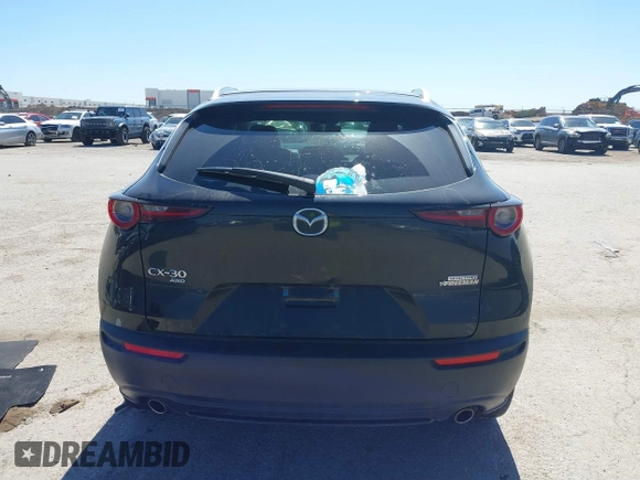2022 Mazda CX-30 S Select z VIN 3MVDMBBL7NM413447, wystawiony jako IAAI lot #41772804 z przebiegiem 69 102 mil mil oraz . Historia ofert i sprzedaży dostępna na DreamBid. Obrazek 16.