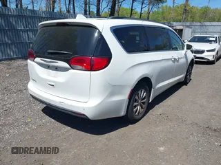 2017 Chrysler Pacifica Touring L with VIN 2C4RC1BG0HR821230, listed as a IAAI auction lot 42158120 with 98,354 mi miles and . Bid and sale history available at DreamBid. Image 4.