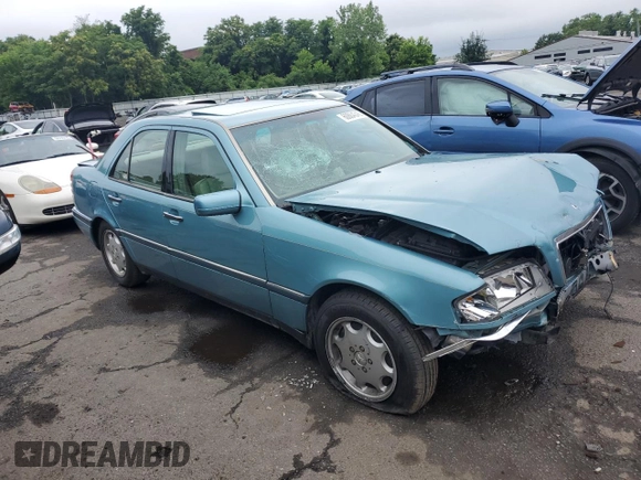 1994 Mercedes-Benz C 230/260/280/320 with VIN WDBHA28E8RF098148, listed as a Copart auction lot 60884345 with 238,600 mi miles and Salvage title. Bid and sale history available at DreamBid. Image 4.