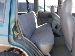 1997 Jeep Cherokee Sport with VIN 1J4FJ68S4VL592390, listed as a IAAI auction lot 41682369 with 194,624 mi miles. Bid and sale history available at carsss.com. Image 8.