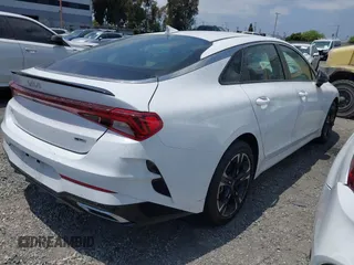 2023 Kia K5 GT-Line z VIN 5XXG64J25PG220733, wystawiony jako IAAI lot #42109640 z przebiegiem 30 917 mil mil oraz . Historia ofert i sprzedaży dostępna na DreamBid. Obrazek 4.