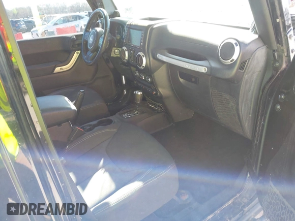 2013 Jeep Wrangler Unlimited Sahara with VIN 1C4BJWEG3DL617511, listed as a IAAI auction lot 41842979 with 149,980 mi miles and . Bid and sale history available at DreamBid. Image 5.