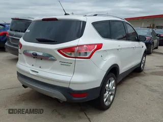 2014 Ford Escape Titanium with VIN 1FMCU0JX7EUB00220, listed as a IAAI auction lot 41945725 with 162,385 mi miles. Bid and sale history available at carsss.com. Image 4.