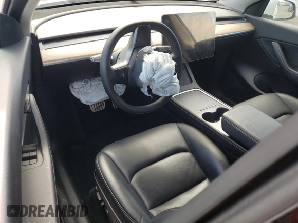 2022 Tesla Model Y Performance с VIN 7SAYGDEF2NF405596, выставлен на аукционе Copart как лот 52868195 с пробегом Не указан миль и Списание • Salvage title. История ставок и продаж доступна на DreamBid. Изображение 8.