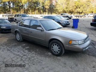 1990 Nissan Maxima z VIN JN1HJ01P3LT393901, wystawiony jako Copart lot #79912694 z przebiegiem 127 678 mil mil oraz Szkody całkowita. Historia ofert i sprzedaży dostępna na DreamBid. Obrazek 4.