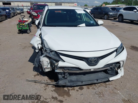 2019 Toyota Camry LE with VIN 4T1B11HK4KU180995, listed as a IAAI auction lot 42088737 with 133,813 mi miles and . Bid and sale history available at DreamBid. Image 6.