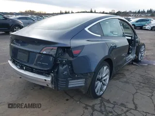 2018 Tesla Model 3 Long Range Battery with VIN 5YJ3E1EB9JF097118, listed as a IAAI auction lot 41619510 with 64,132 mi miles and . Bid and sale history available at DreamBid. Image 4.