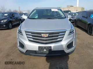2019 Cadillac XT5 Premium Luxury AWD z VIN 1GYKNFRS2KZ227166, wystawiony jako IAAI lot #41786410 z przebiegiem 99 576 mil mil oraz . Historia ofert i sprzedaży dostępna na DreamBid. Obrazek 12.
