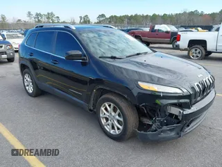 2014 Jeep Cherokee Latitude with VIN 1C4PJLCB0EW288309, listed as a IAAI auction lot 41624746 with 164,037 mi miles and . Bid and sale history available at DreamBid. Image 1.