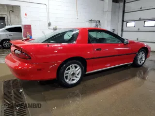 1994 Chevrolet Camaro z VIN 2G1FP22S0R2105030, wystawiony jako Copart lot #45131955 z przebiegiem 166 107 mil mil oraz Czysty tytuł • Clean title. Historia ofert i sprzedaży dostępna na DreamBid. Obrazek 3.