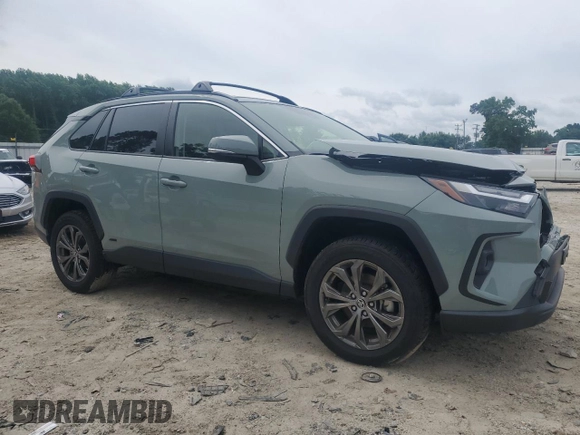 2023 Toyota RAV4 Hybrid XLE Premium with VIN JTMB6RFV8PD097109, listed as a Copart auction lot 59970995 with 43,197 mi miles and Salvage title. Bid and sale history available at DreamBid. Image 4.