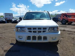 2000 Isuzu Rodeo S with VIN 4S2CK58W6Y4355597, listed as a IAAI auction lot 41775764 with 122,776 mi miles. Bid and sale history available at carsss.com. Image 12.