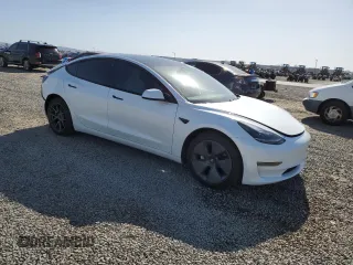 2021 Tesla Model 3 Standard Range Plus with VIN 5YJ3E1EA0MF072457, listed as a Copart auction lot 51666135 with 32,534 mi miles and Salvage Title. Bid and sale history available at carsss.com. Image 4.