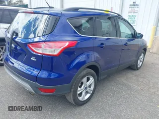 2014 Ford Escape SE with VIN 1FMCU9G93EUC54050, listed as a IAAI auction lot 42062980 with 129,015 mi miles. Bid and sale history available at carsss.com. Image 4.