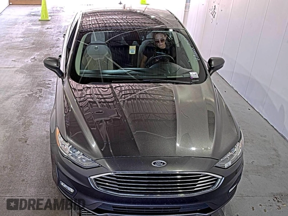 2020 Ford Fusion SE z VIN 3FA6P0HD6LR189762, wystawiony jako IAAI lot #42780149 z przebiegiem 51 099 mil mil oraz . Historia ofert i sprzedaży dostępna na DreamBid. Obrazek 19.