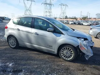 2015 Ford C-Max Energi SEL with VIN 1FADP5CU9FL115721, listed as a IAAI auction lot 41309845 with 67,819 mi miles. Bid and sale history available at carsss.com. Image 1.