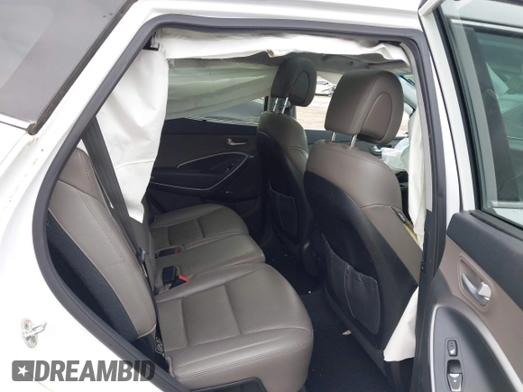 2014 Hyundai Santa Fe z VIN 5XYZUDLB9EG227009, wystawiony jako IAAI lot #42272191 z przebiegiem 97 474 mil mil oraz . Historia ofert i sprzedaży dostępna na DreamBid. Obrazek 8.