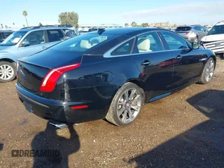 2015 Jaguar XJ with VIN SAJWA1CZ2F8V84677, listed as a IAAI auction lot 41723372 with 52,888 mi miles. Bid and sale history available at carsss.com. Image 4.