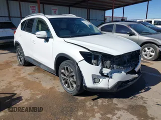 2016 Mazda CX-5 Grand Touring z VIN JM3KE2DY5G0681862, wystawiony jako IAAI lot #41345433 z przebiegiem Nie podano mil oraz . Historia ofert i sprzedaży dostępna na DreamBid. Obrazek 1.
