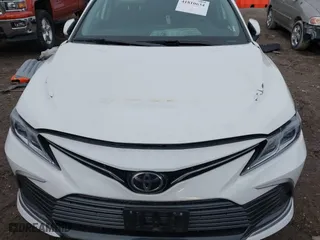 2024 Toyota Camry LE with VIN 4T1C11AK5RU899617, listed as a IAAI auction lot 41810634 with 24,295 mi miles. Bid and sale history available at carsss.com. Image 6.
