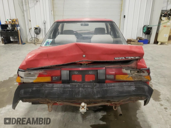 1989 Toyota Tercel z VIN JT2EL31DXK0410350, wystawiony jako Copart lot #79207084 z przebiegiem 189 827 mil mil oraz Szkoda całkowita • Salvage title. Historia ofert i sprzedaży dostępna na DreamBid. Obrazek 6.