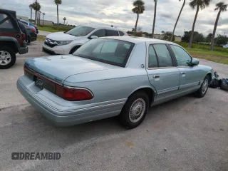 1996 Mercury Grand Marquis GS with VIN 2MELM74W5TX653873, listed as a Copart auction lot 74659254 with 86,589 mi miles and Salvage Title. Bid and sale history available at DreamBid. Image 3.