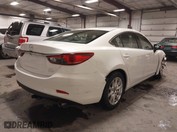 2016 Mazda Mazda6 i Sport with VIN JM1GJ1U54G1473671, listed as a IAAI auction lot 41576038 with 88,386 mi miles. Bid and sale history available at carsss.com. Image 4.