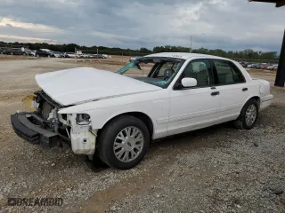 2003 Ford Crown Victoria LX with VIN 2FAFP74W03X158931, listed as a Copart auction lot 71588824 with 165,074 mi miles and Salvage Title. Bid and sale history available at carsss.com. Image 1.