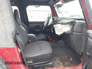 2002 Jeep Wrangler X z VIN 1J4FA39S52P708519, wystawiony jako IAAI lot #41569747 z przebiegiem 219 168 mil mil oraz . Historia ofert i sprzedaży dostępna na DreamBid. Obrazek 5.