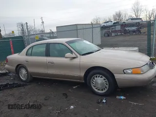 1997 Lincoln Continental with VIN 1LNLM97V3VY666104, listed as a IAAI auction lot 41650904 with 181,536 mi miles. Bid and sale history available at carsss.com. Image 13.