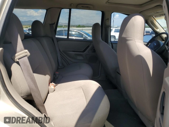 2003 Jeep Grand Cherokee Laredo with VIN 1J4GW48S23C524693, listed as a Copart auction lot 64461755 with 243,936 mi miles and Salvage title. Bid and sale history available at DreamBid. Image 11.