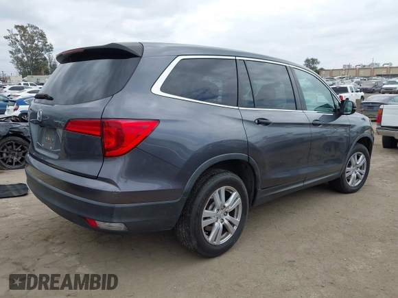 2016 Honda Pilot LX with VIN 5FNYF5H14GB037205, listed as a IAAI auction lot 42034018 with 101,943 mi miles and . Bid and sale history available at DreamBid. Image 4.